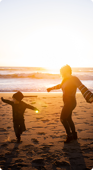 family playing on a beach
