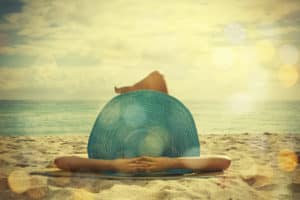 oung woman lying on the beach