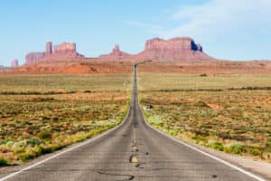 Empty road to Monument Valley, Arizona, USA