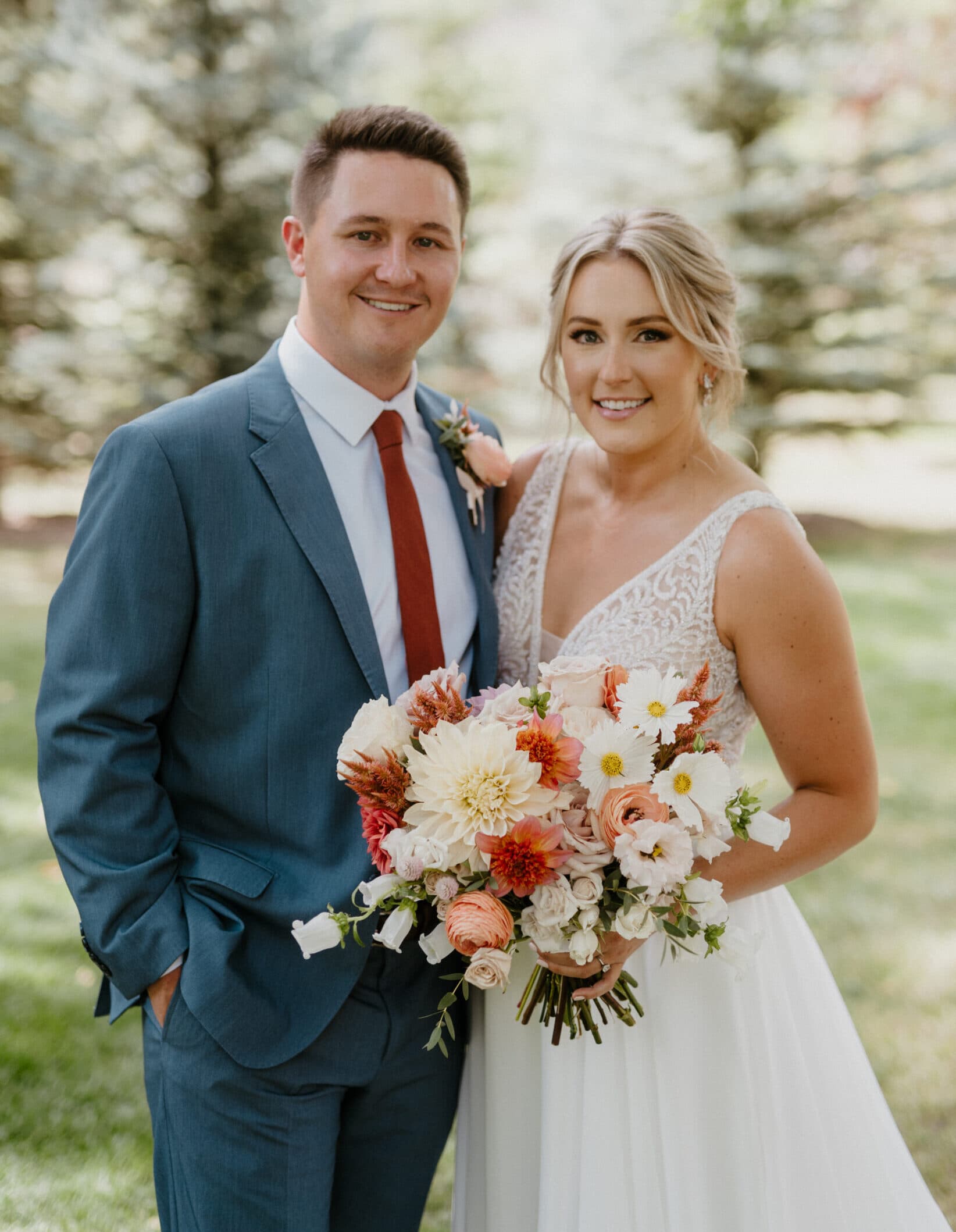 Bride and groom standing next to each other