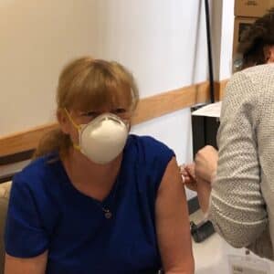 image of leigh anne getting a vaccine