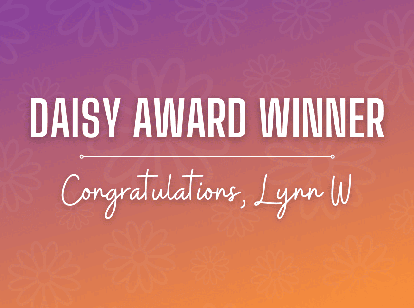 Purple and orange background with white letters that say "Daisy Award Winner Congratulations Lynn W"