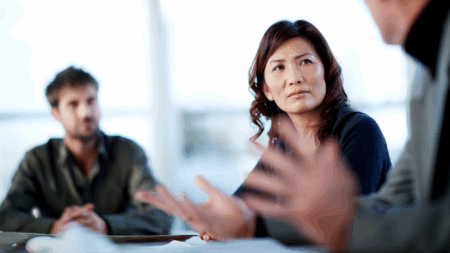 healthcare-professionals-talking-around-conference-room-table