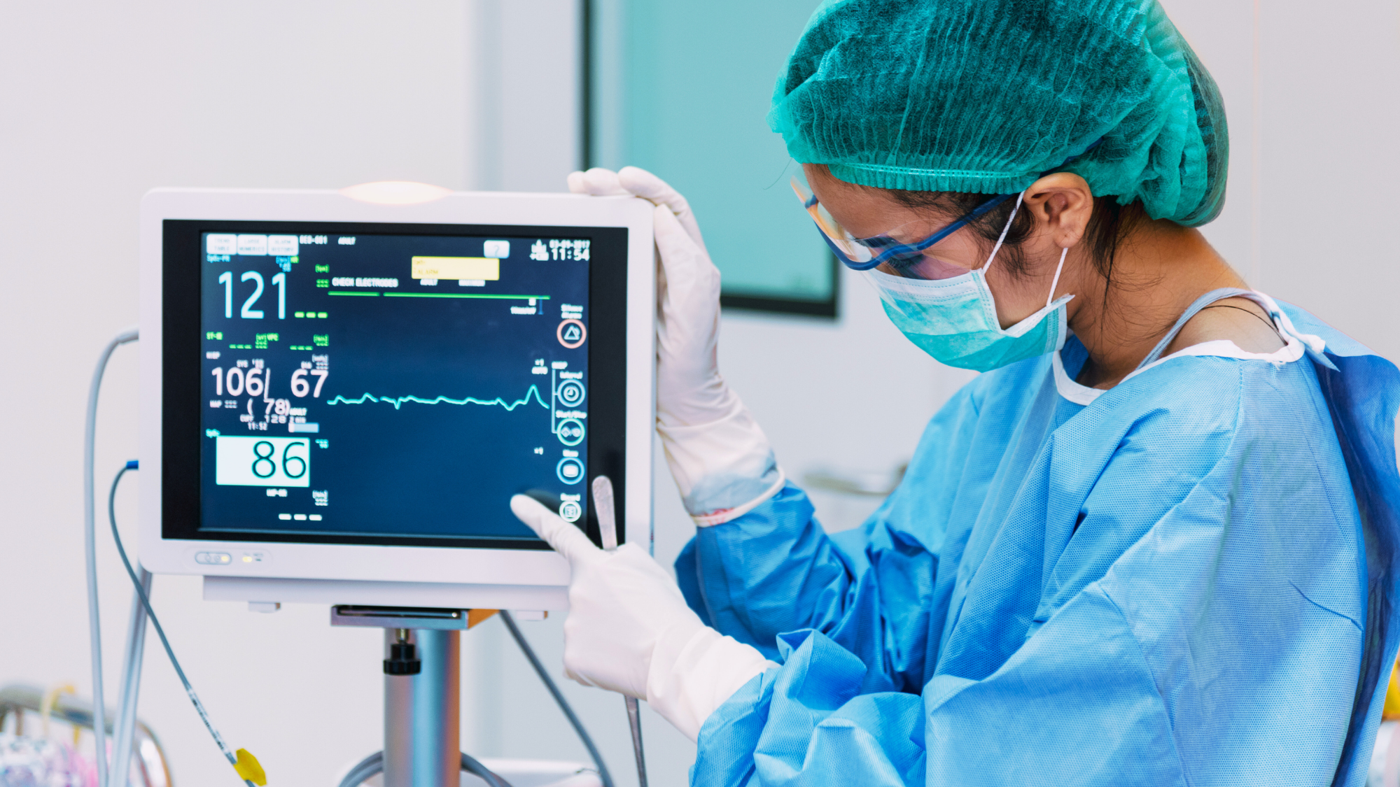 Female nurse pointing at a monitor