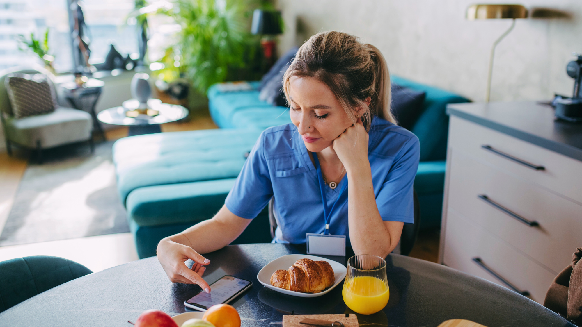Female nurse eating at a hospital caffeteria