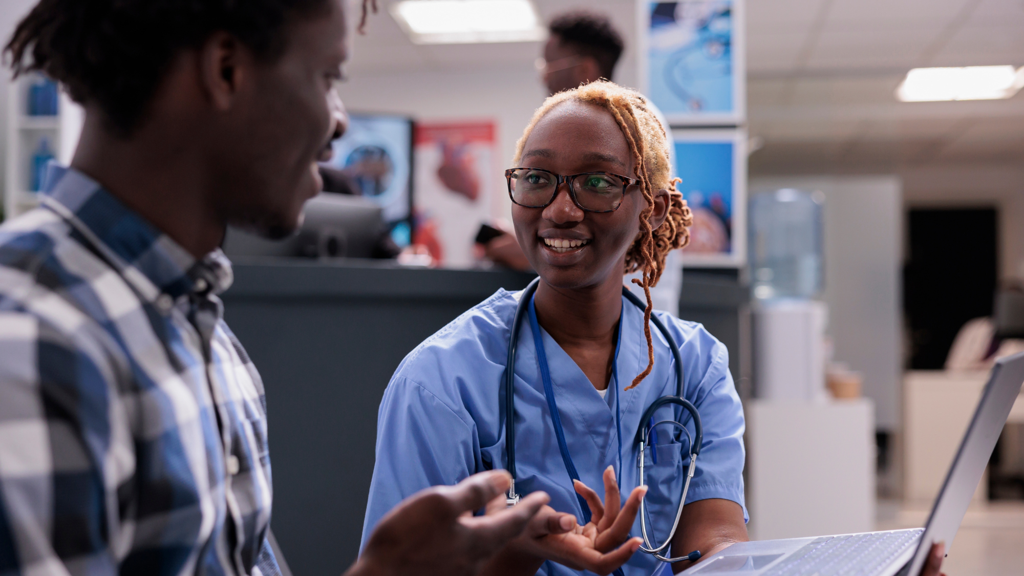 Female nurse talking with a patient at a hospital