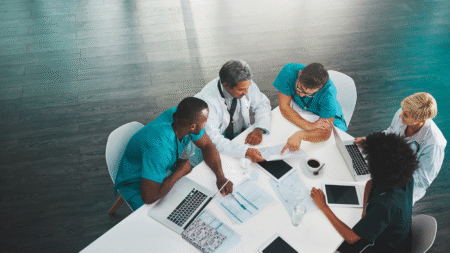 clinicians-looking-at-data-on-table