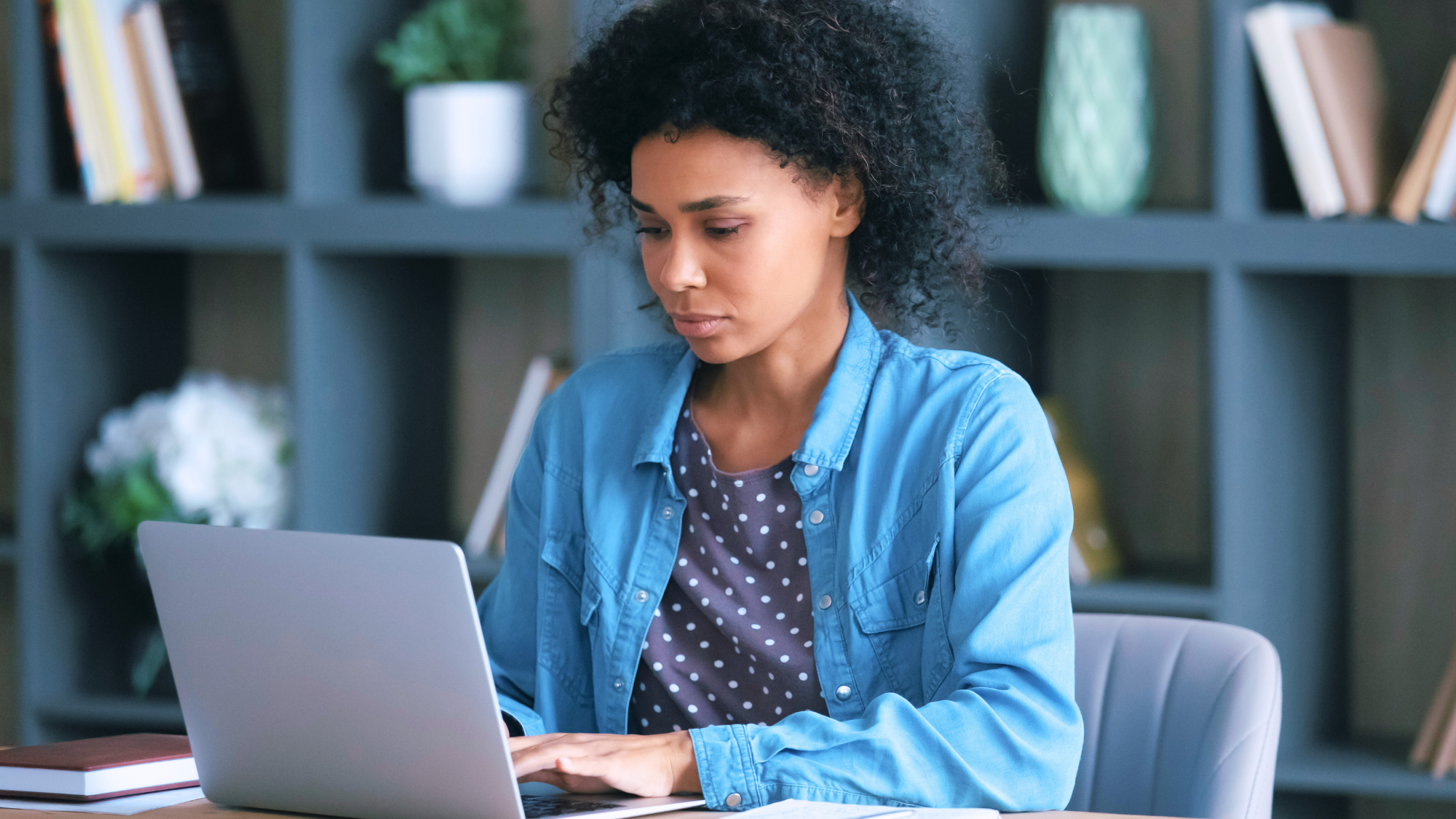 Female nurse typing on computer