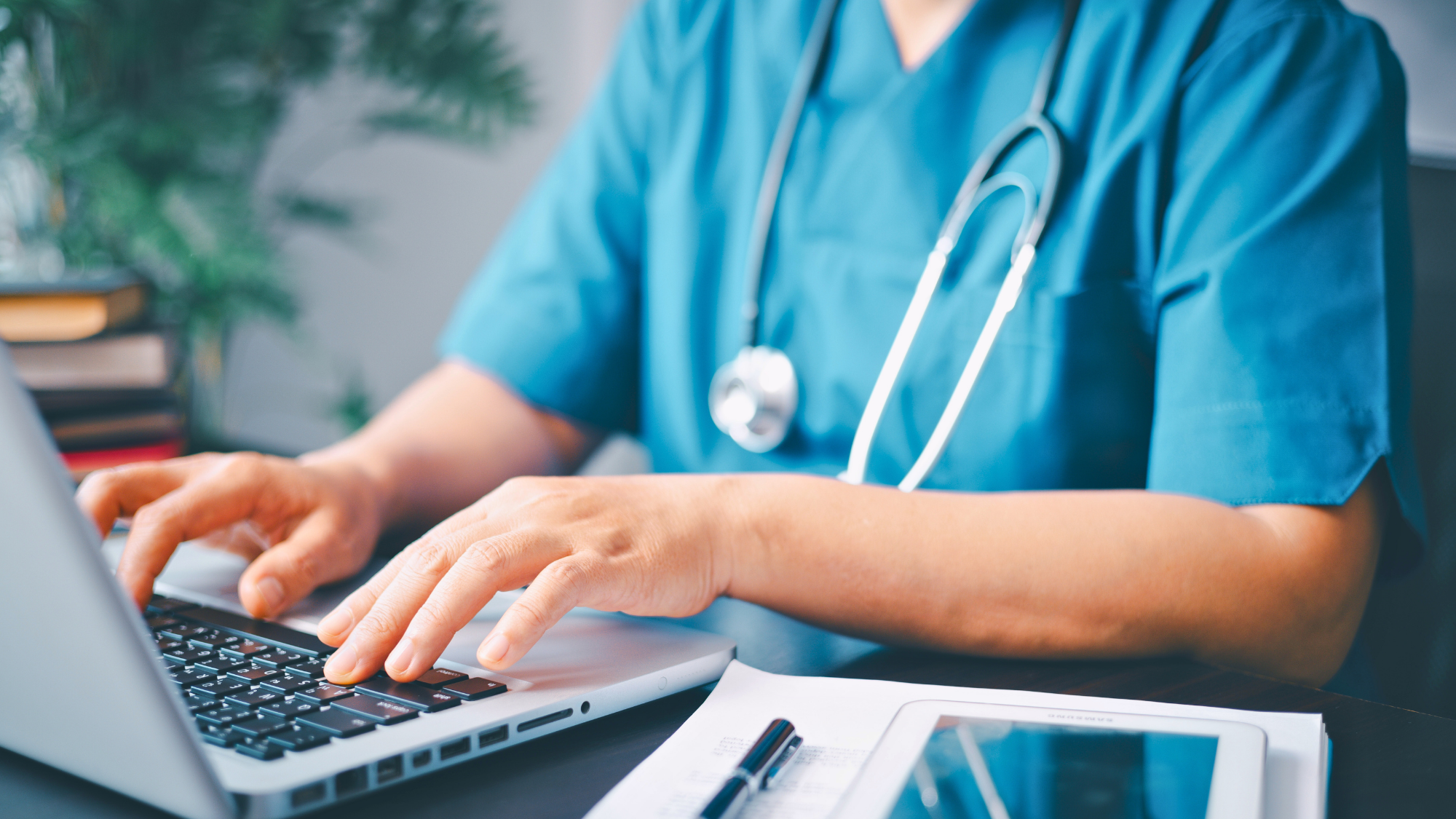 Nurse hands typing on computer