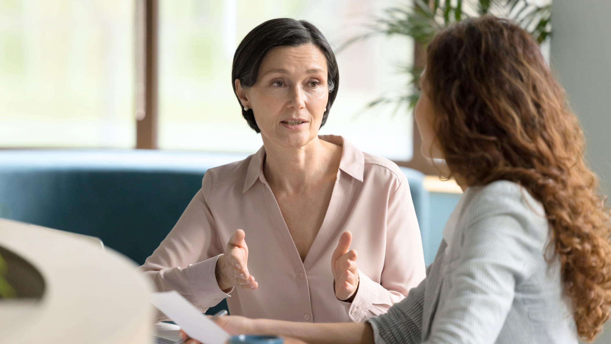 Healthcare workforce partner in a discussion with client signifying collaboration and partnership