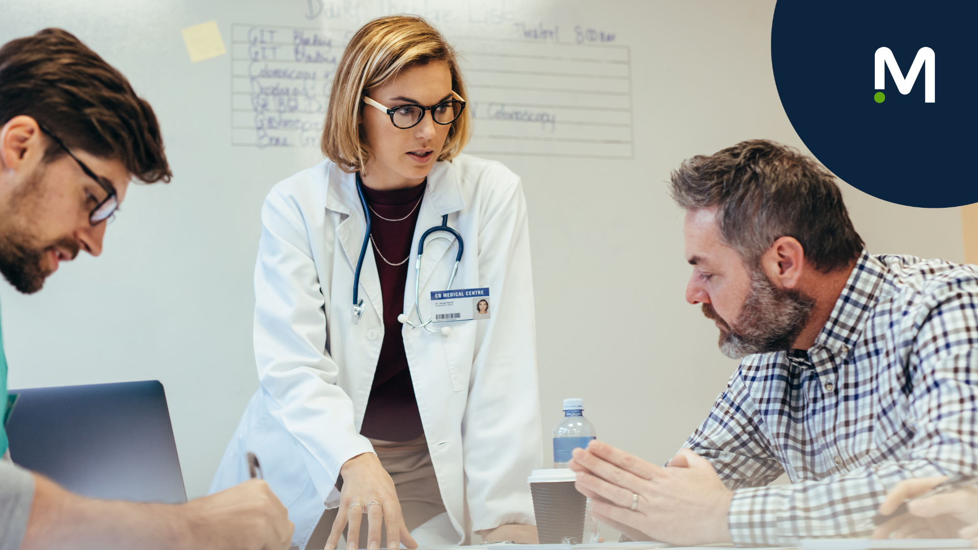 Healthcare professional in white coat discussing staffing strategy with workforce partners